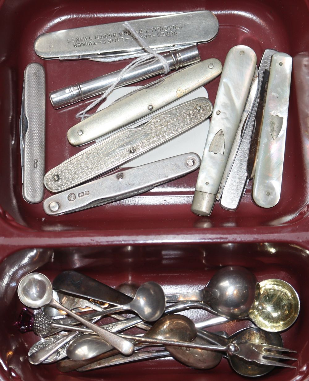 A George V silver cylindrical pill dispenser, William Vale & Sons, Birmingham, 1918, 69mm, 8 pen knives and a group of condiment spoons